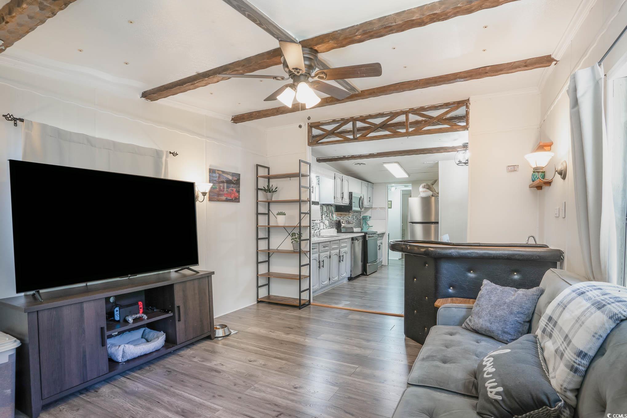 127 Offshore Drive Murrells Inlet, SC 29576 - Photo 10 of 40 Living room with light wood-style flooring, ceiling fan, and beam ceiling