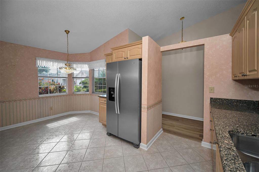1481 Cairn Court Palm Harbor, FL 34683 - Photo 16 of 40 a kitchen with refrigerator and window