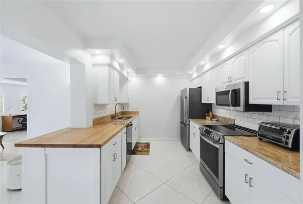 a kitchen with a sink and cabinets
