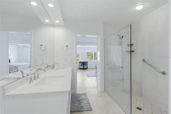 a view of a workspace with furniture and window