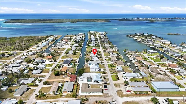 a swimming pool with outdoor seating and yard