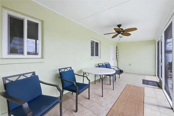 a view of a dining room with furniture window and outside view
