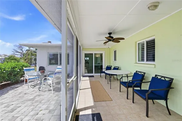 a building outdoor space with patio furniture and garden