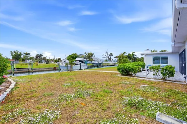 a view of outdoor space with garden and trees