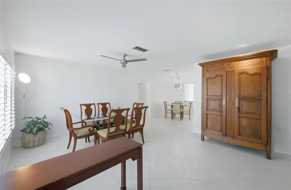 a dining room with furniture and window