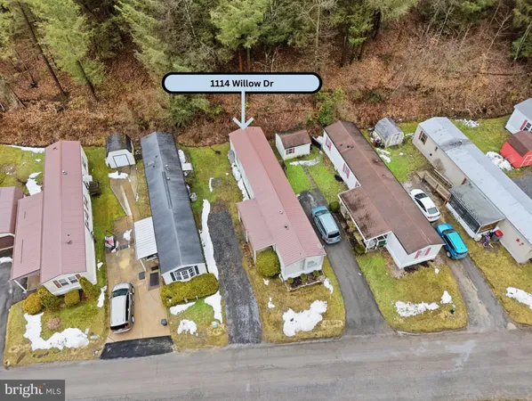 an aerial view of a swimming pool patio and outdoor seating