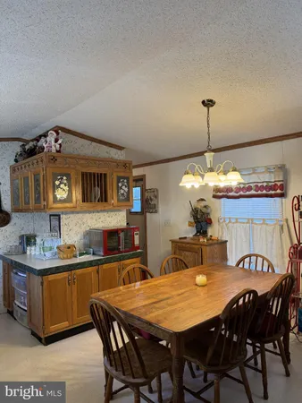a dining room with a table and chairs