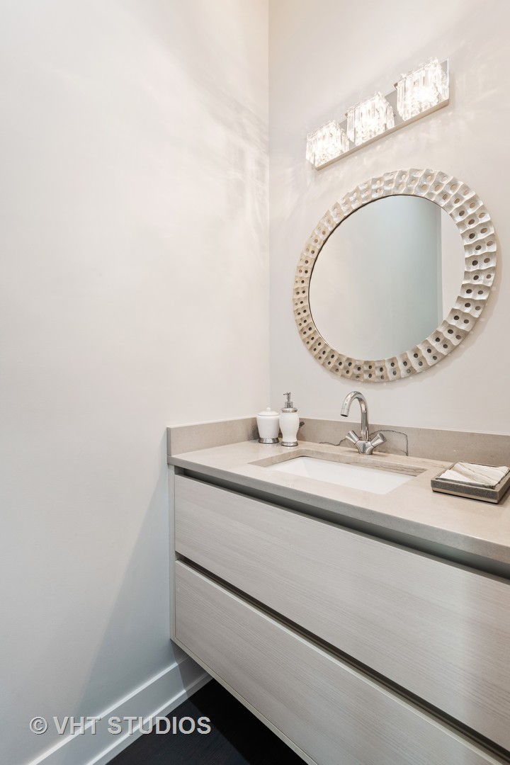 120 16th Street Wilmette, IL 60091 - Photo 13 of 34 a bathroom with a sink and a mirror