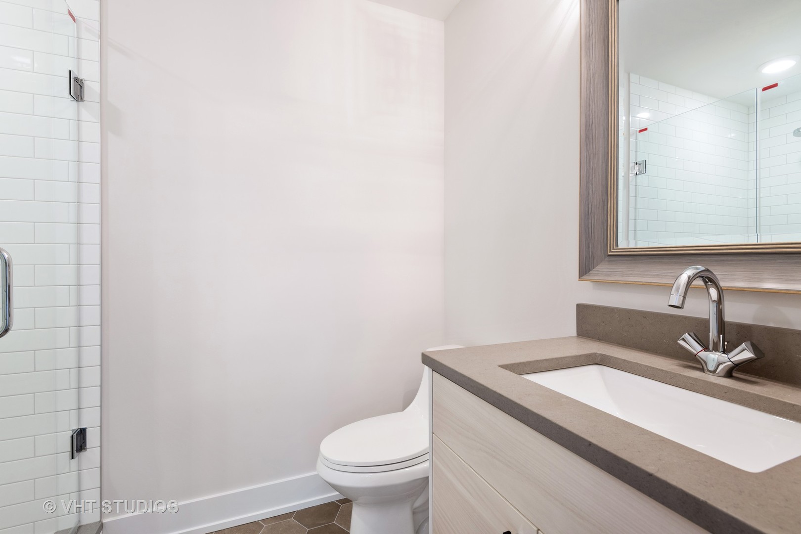 120 16th Street Wilmette, IL 60091 - Photo 23 of 34 a bathroom with a sink a toilet and a mirror
