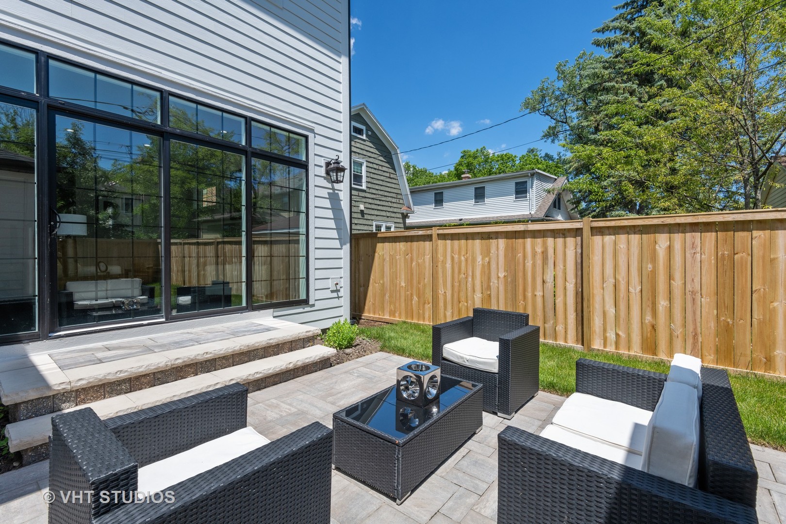 120 16th Street Wilmette, IL 60091 - Photo 29 of 34 a view of a patio with a table chairs and a backyard