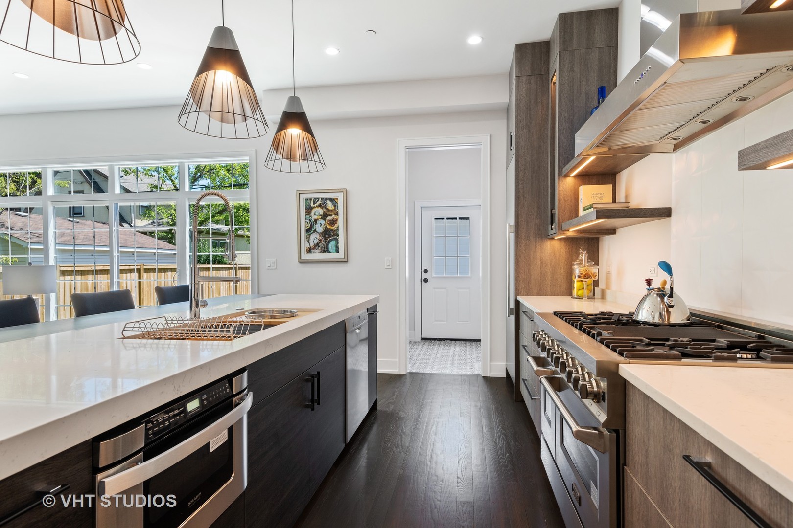 120 16th Street Wilmette, IL 60091 - Photo 7 of 34 a kitchen with stainless steel appliances granite countertop a sink a stove and a wooden floors