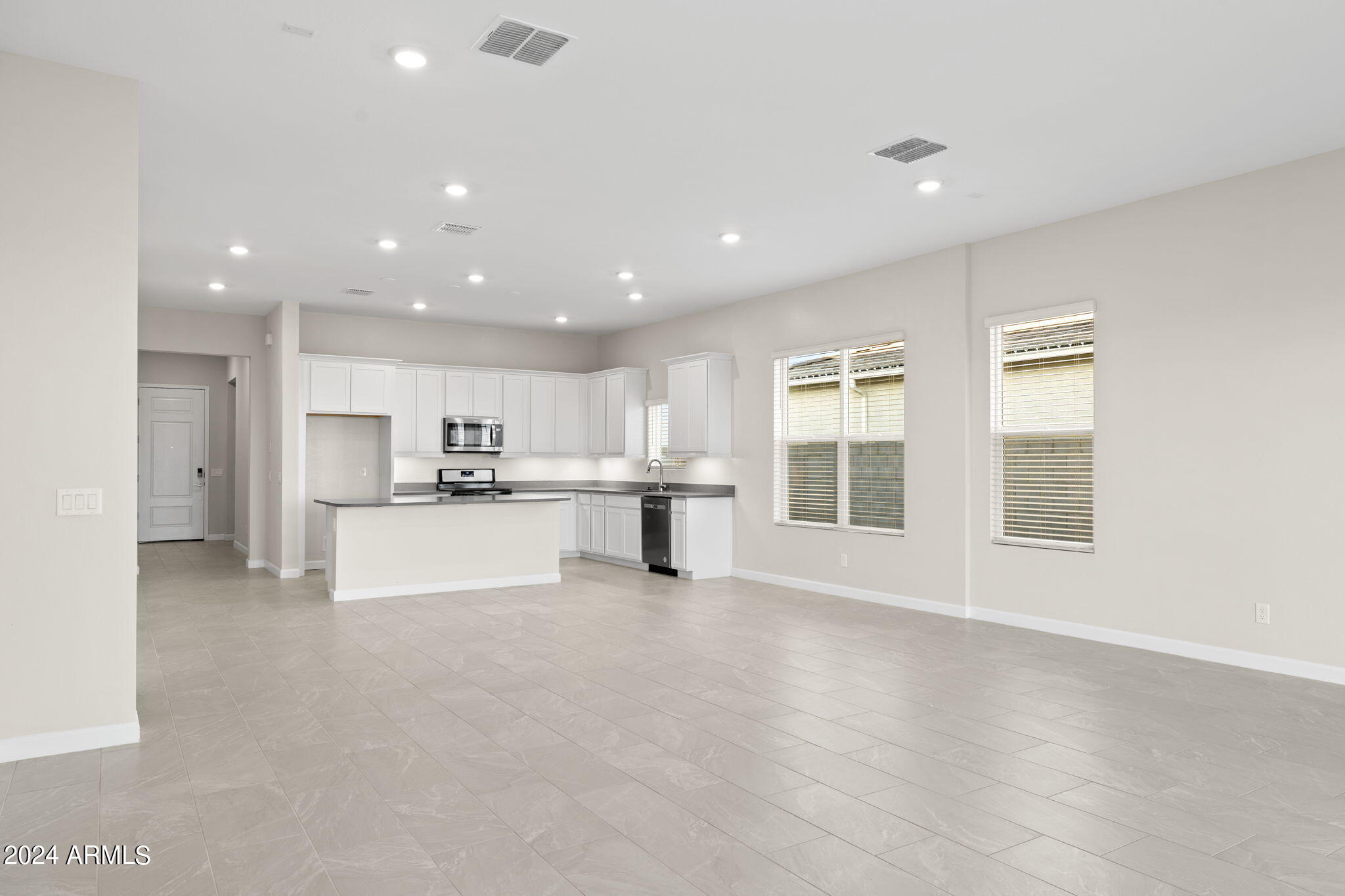 17750 West Hatcher Road Waddell, AZ 85355 - Photo 4 of 11 McCormick kitch great room