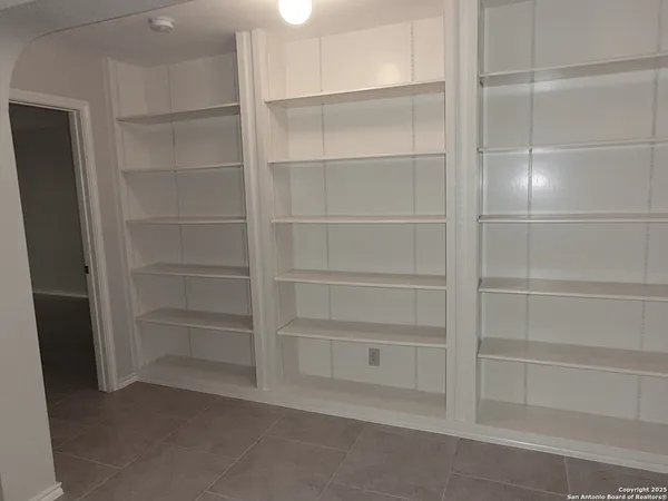 a view of an empty walk in closet