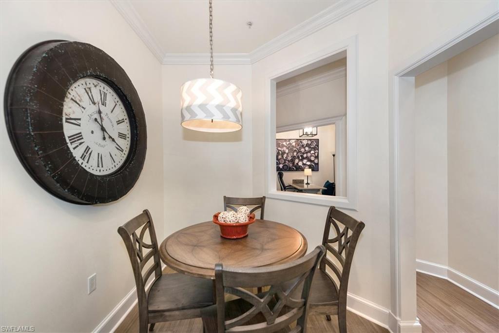 555 5th Avenue South, Unit 204 Naples, FL 34102 - Photo 15 of 30 a view of a dining room with furniture and a window