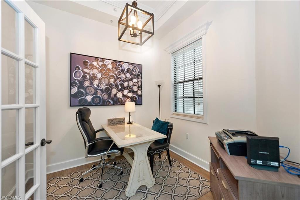 555 5th Avenue South, Unit 204 Naples, FL 34102 - Photo 16 of 30 a workspace with furniture and a window