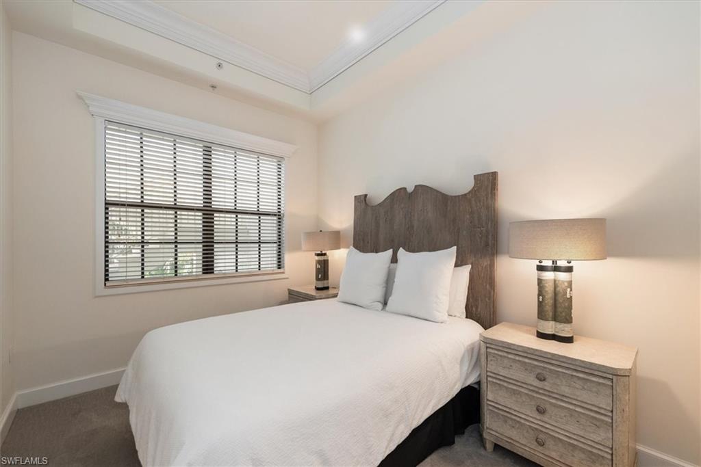 555 5th Avenue South, Unit 204 Naples, FL 34102 - Photo 22 of 30 a bedroom with a bed and window