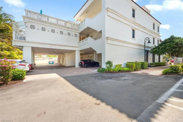 a view of a building with potted plants