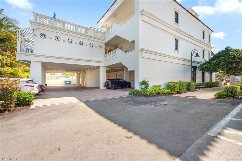 555 5th Avenue South, Unit 204 Naples, FL 34102 - Photo 25 of 30 a view of a building with potted plants