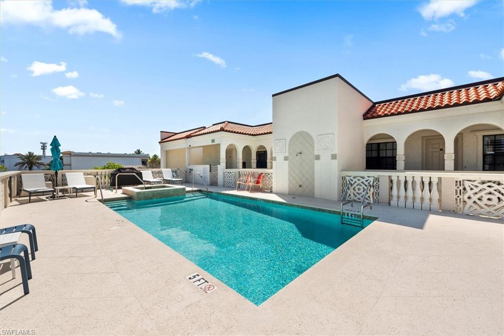 555 5th Avenue South, Unit 204 Naples, FL 34102 - Photo 26 of 30 a view of a house with a yard and furniture