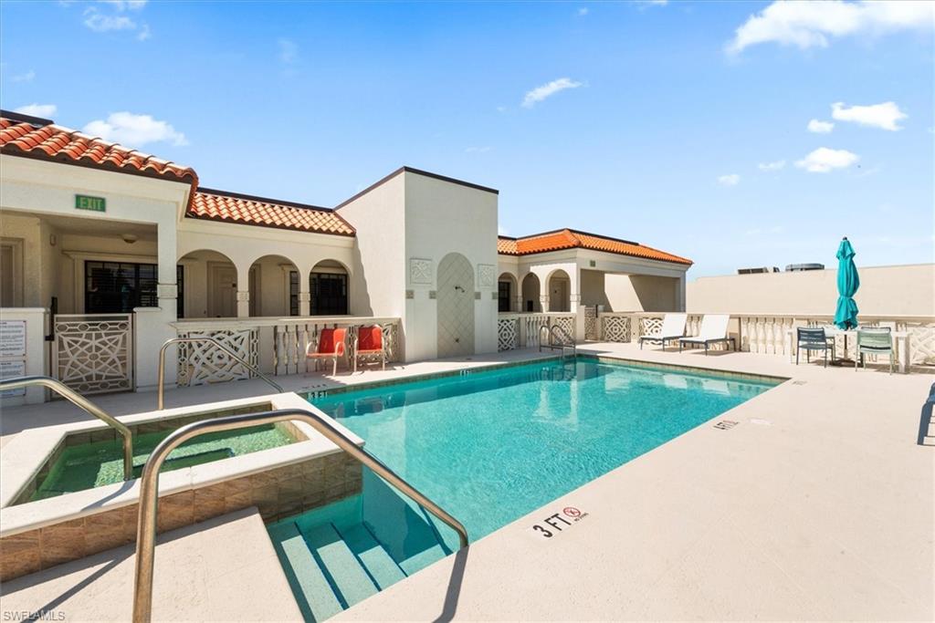 555 5th Avenue South, Unit 204 Naples, FL 34102 - Photo 28 of 30 a front view of a house with swimming pool
