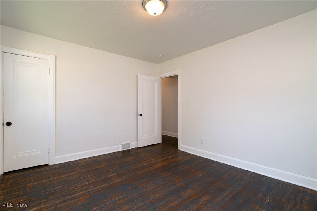 12727 Grannis Road Cleveland, OH 44125 - Photo 20 of 43 Unfurnished room with wood-type flooring