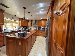 112 Robin Court Hercules, CA 94547 - Photo 14 of 21 a kitchen with kitchen island granite countertop a sink stainless steel appliances and cabinets