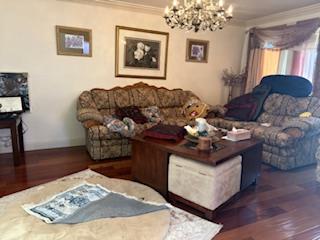 112 Robin Court Hercules, CA 94547 - Photo 3 of 21 a living room with furniture and a chandelier