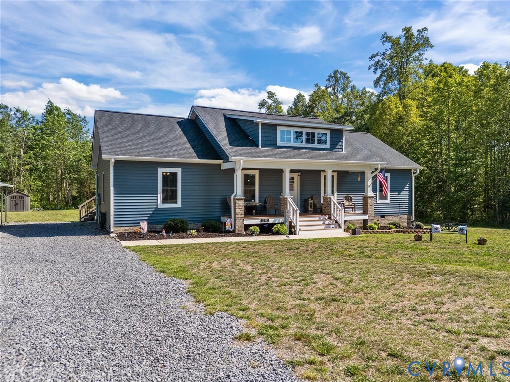 10819 Vaughan Road Petersburg, VA 23805 - Photo 4 of 45 Ranch-style exterior with blue siding and a dark g