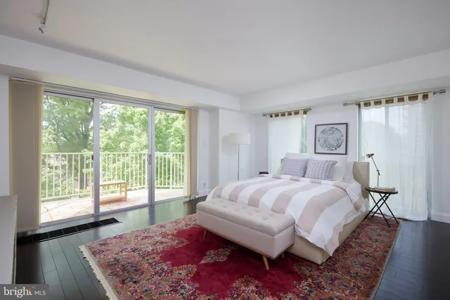 a bedroom with a bed and a couch