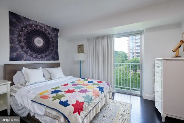 a bedroom with a bed and a dresser