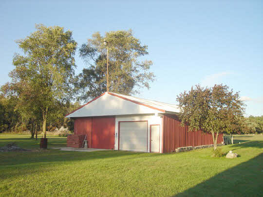 1283 Fischer Road South Beloit, IL 61080 - Photo 6 of 6 a view of a house with a yard