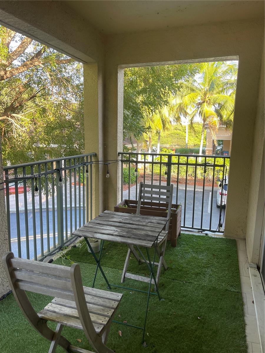 2541 Centergate Drive, Unit 205 Miramar, FL 33025 - Photo 16 of 28 a view of a two chairs in the patio