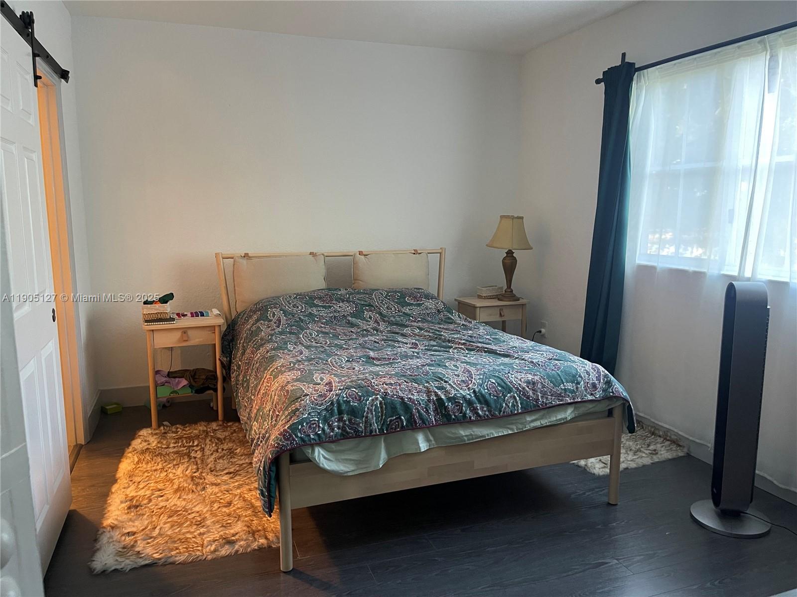 2541 Centergate Drive, Unit 205 Miramar, FL 33025 - Photo 5 of 28 a bedroom with a bed and a window