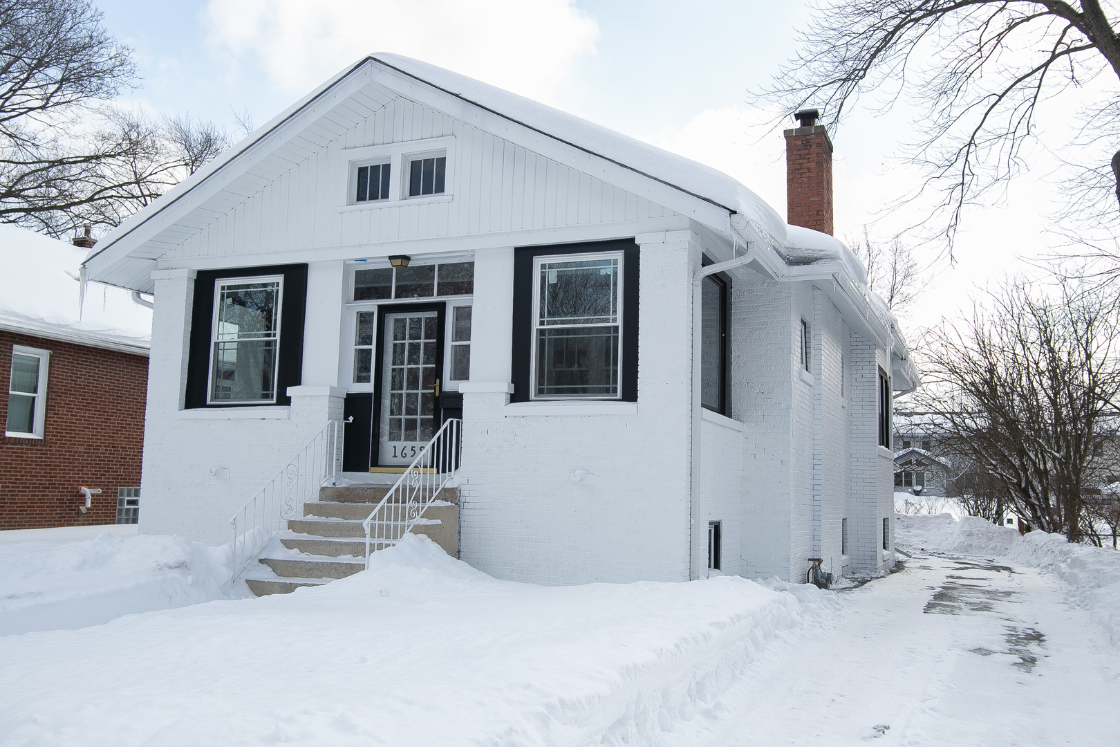 1659 Linden Road Homewood, IL 60430 - Photo 1 of 32 a view of a house with a snow in the yard