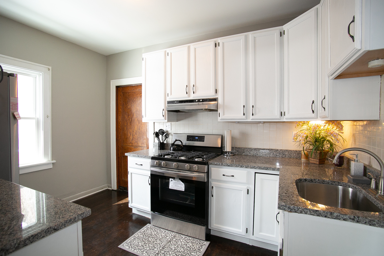 1659 Linden Road Homewood, IL 60430 - Photo 11 of 32 a kitchen with granite countertop a sink stainless steel appliances and cabinets