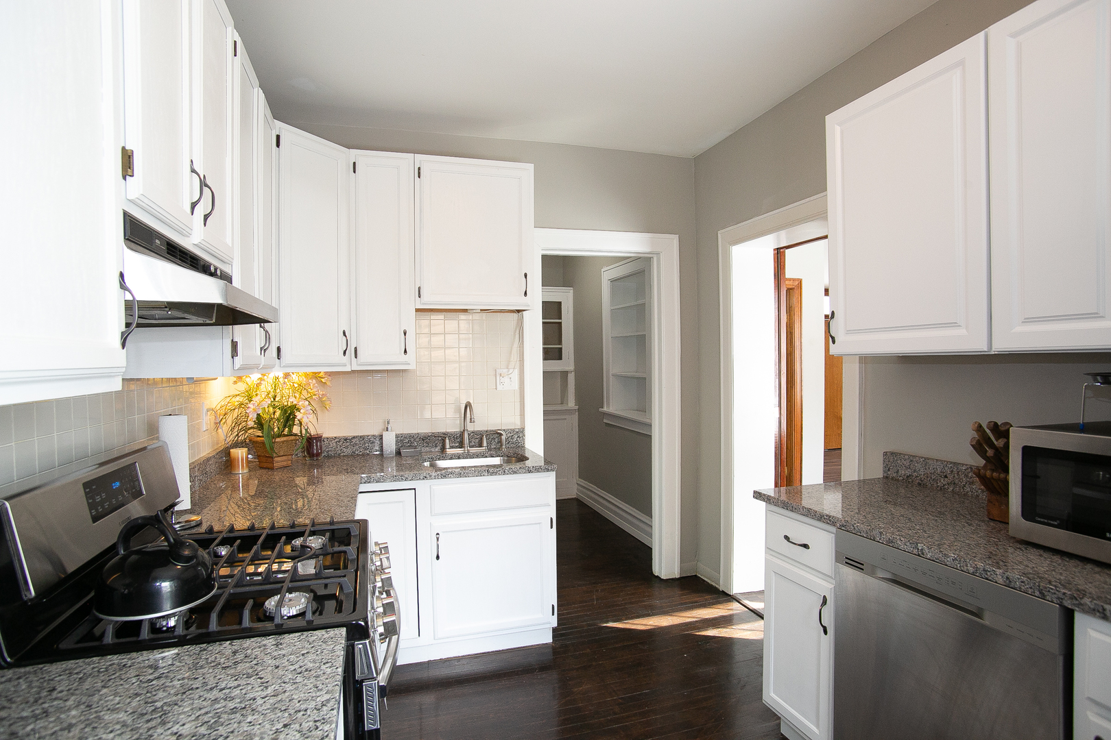 1659 Linden Road Homewood, IL 60430 - Photo 12 of 32 a kitchen with a sink stove and refrigerator