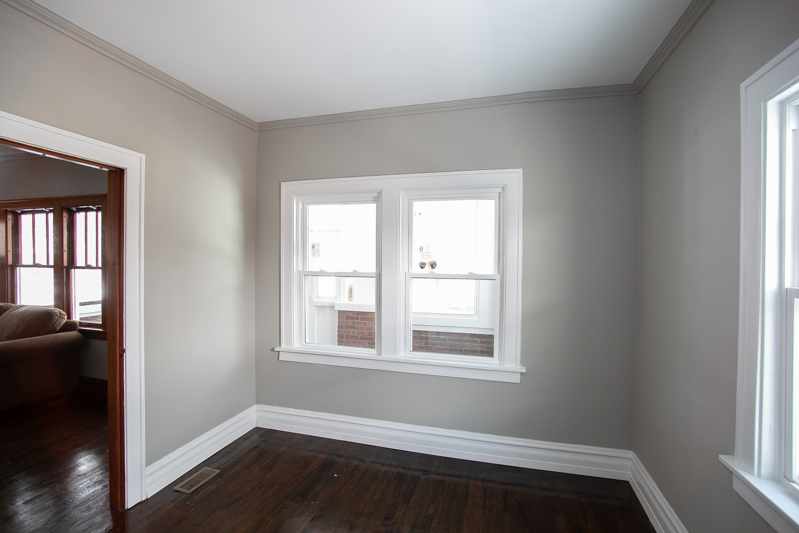 1659 Linden Road Homewood, IL 60430 - Photo 20 of 32 a view of a room with wooden floor and windows
