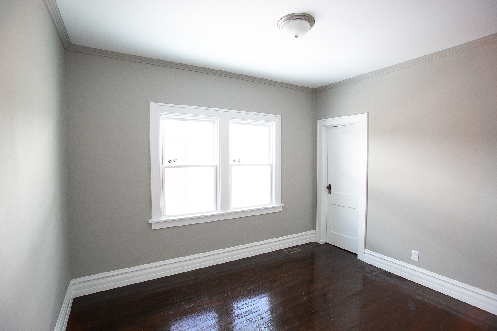 1659 Linden Road Homewood, IL 60430 - Photo 23 of 32 an empty room with wooden floor and windows