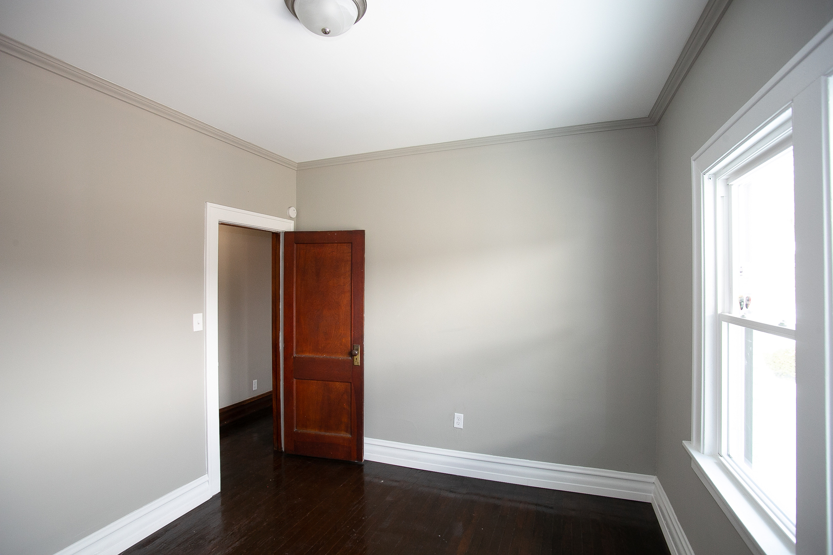 1659 Linden Road Homewood, IL 60430 - Photo 24 of 32 an empty room with wooden floor and window