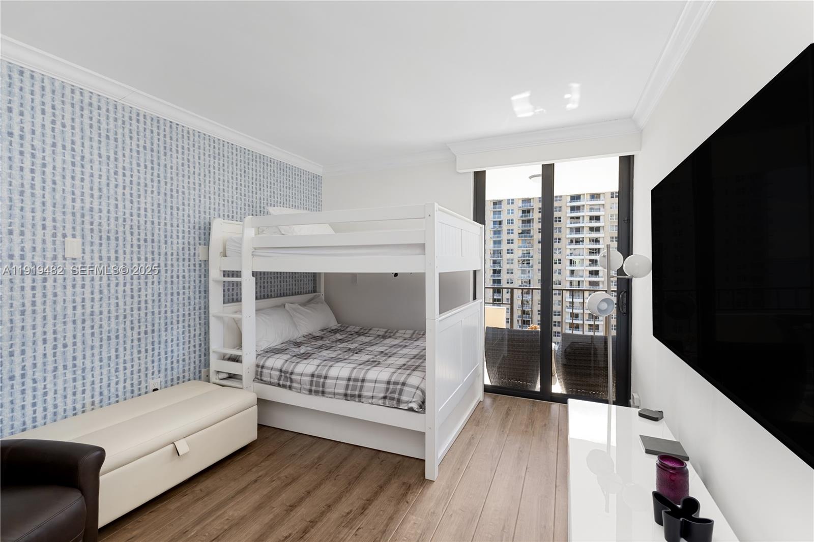 520 Brickell Key Drive, Unit A1207 Miami, FL 33131 - Photo 23 of 33 a bedroom with a bed and a window