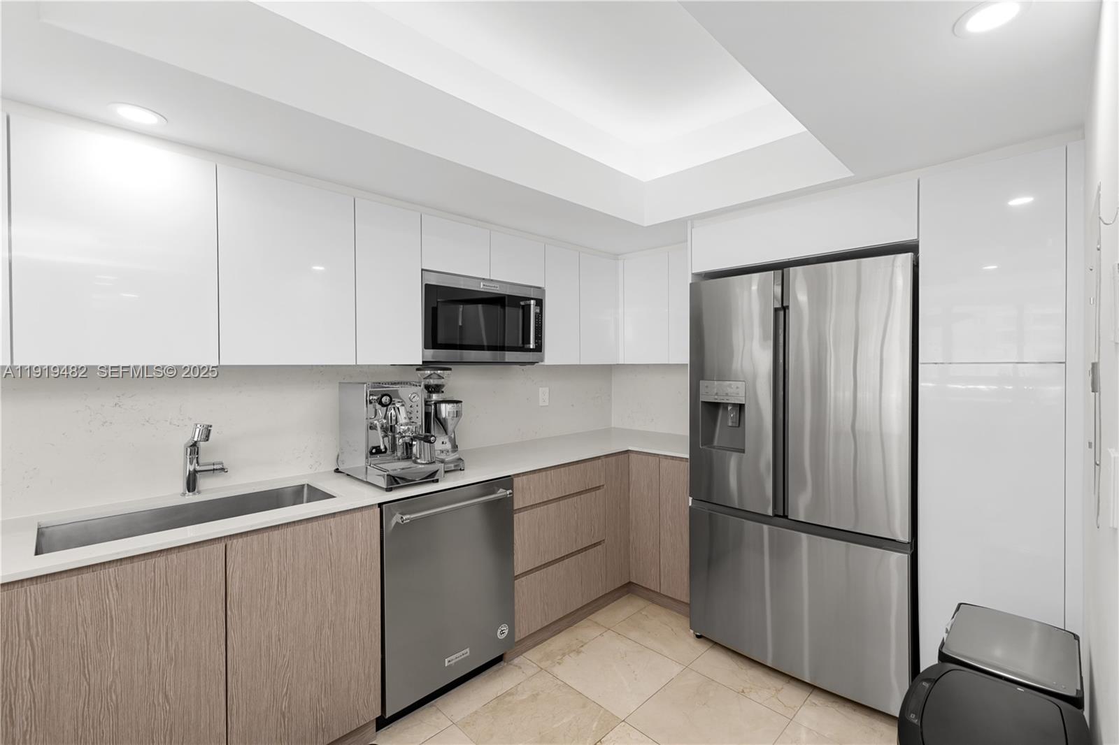 520 Brickell Key Drive, Unit A1207 Miami, FL 33131 - Photo 8 of 33 a kitchen with stainless steel appliances granite countertop a refrigerator sink and microwave