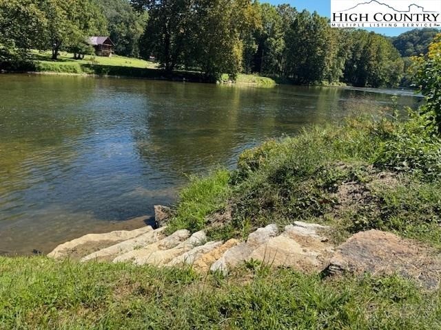 Lot 124 Blue Ridge View Piney Creek, NC 28663 - Photo 11 of 14 a view of a lake with a mountain