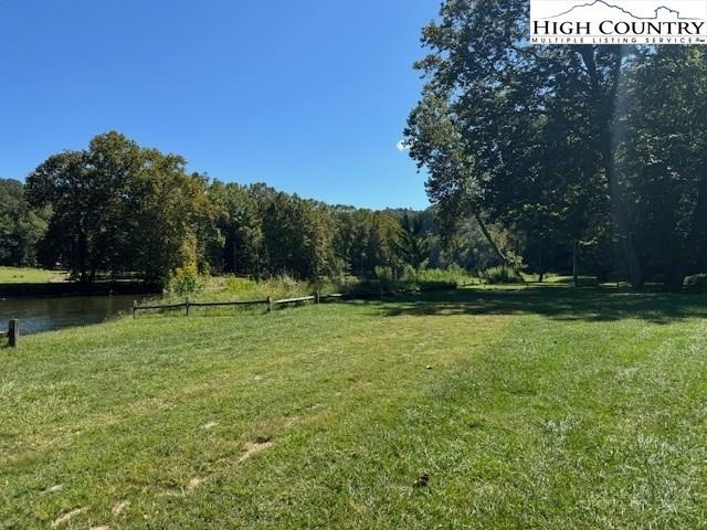 Lot 124 Blue Ridge View Piney Creek, NC 28663 - Photo 10 of 14 a view of a golf course with a lake