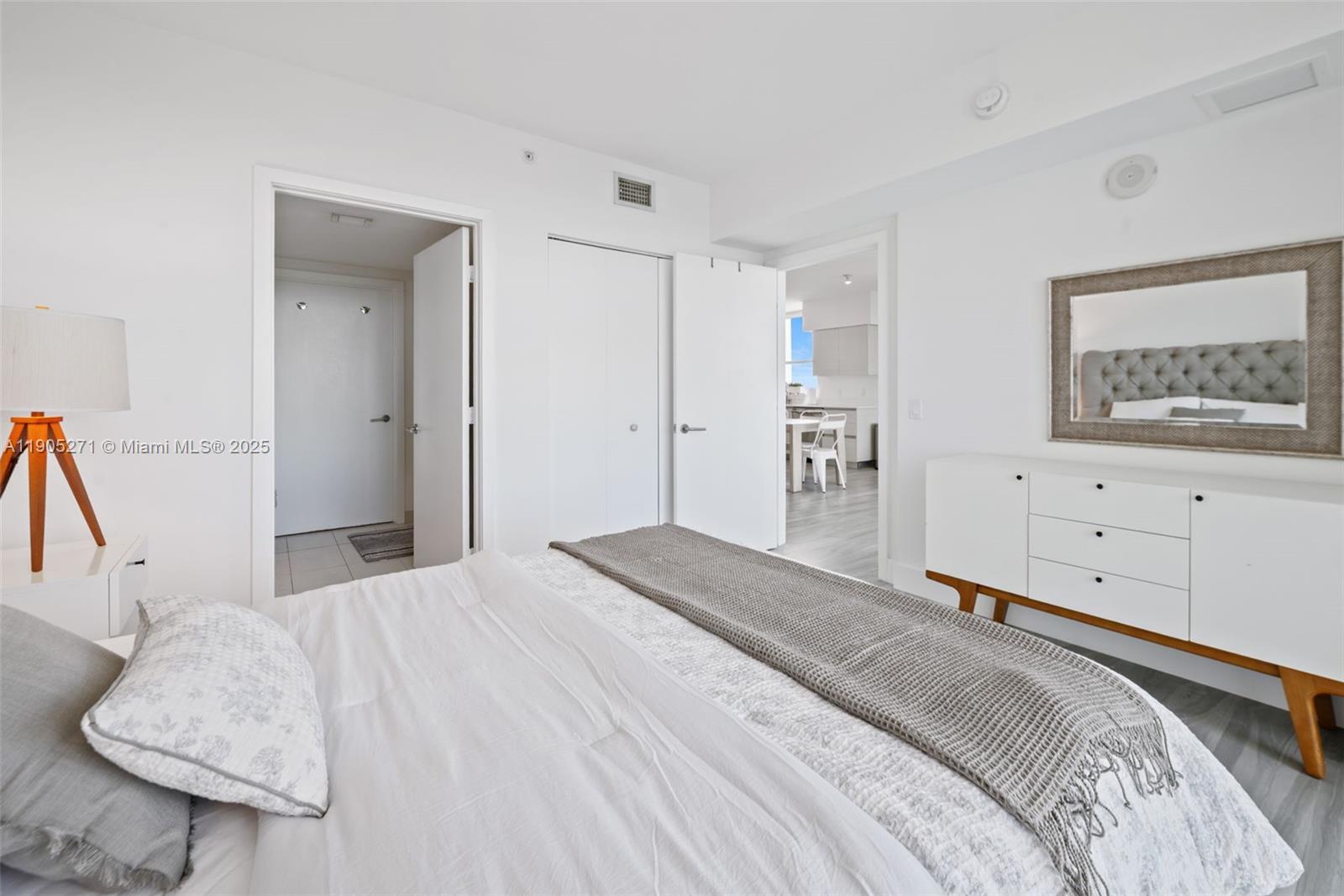 4250 Biscayne Boulevard, Unit 1009 Miami, FL 33137 - Photo 12 of 23 a bedroom with a bed and a couch