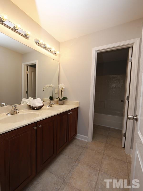 3324 Queensland Road Raleigh, NC 27614 - Photo 20 of 25 The 2nd bathroom upstairs has 2 sinks and the toilet and shower are separated from the sink area for privacy.