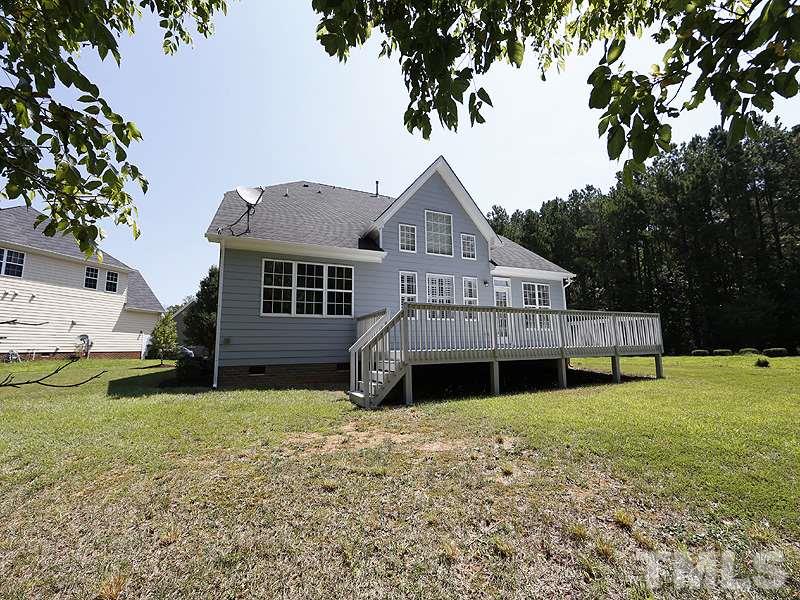 3324 Queensland Road Raleigh, NC 27614 - Photo 25 of 25 A view of the back of the home from the backyard.