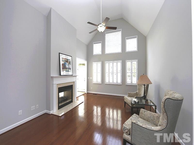 3324 Queensland Road Raleigh, NC 27614 - Photo 10 of 25 The family room has a vaulted ceiling with new ceiling fan and wall of windows. The upper windows have blinds with remote operation and the lower are beautiful shutters. There are multi-media outlets for high tech components/tv.