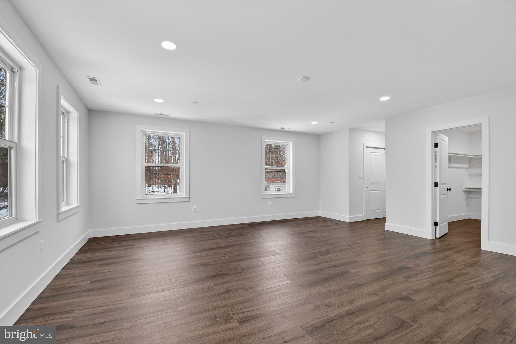 13102 Ideal Drive Silver Spring, MD 20906 - Photo 22 of 48 a view of an empty room with a window and wooden floor