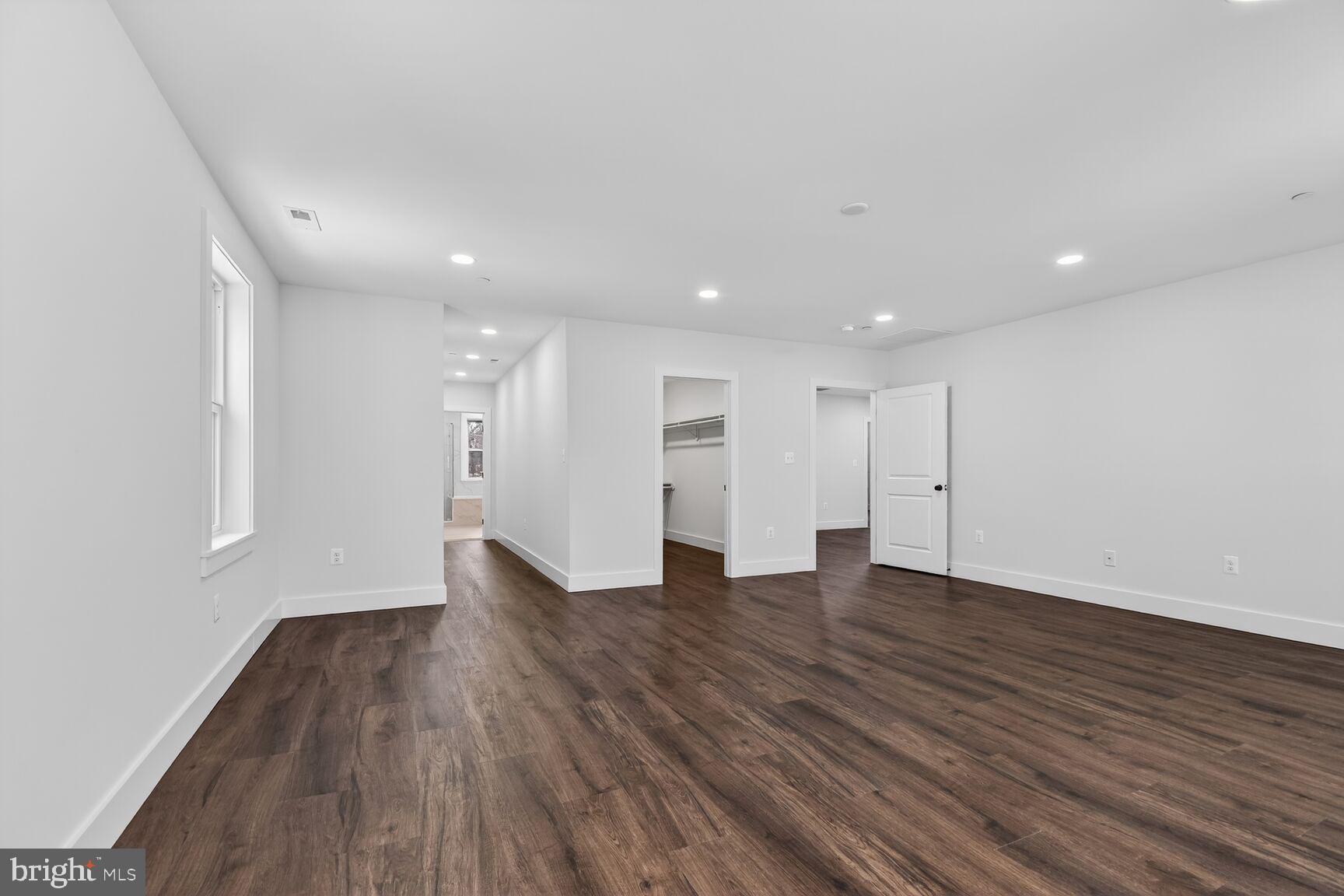 13102 Ideal Drive Silver Spring, MD 20906 - Photo 23 of 48 a view of an empty room with wooden floor and a window