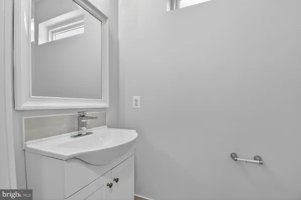 a bathroom with double sink and a shower